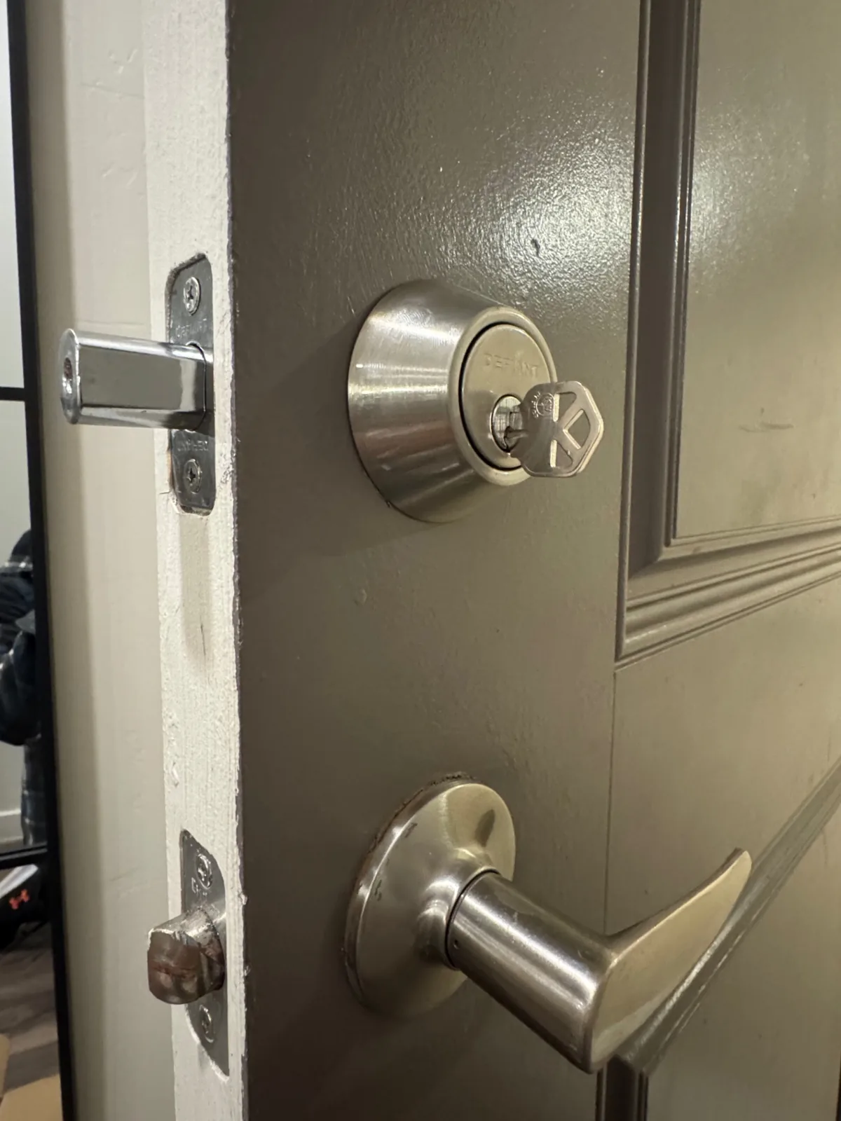 Residential deadbolt being rekeyed on a Phoenix home front door