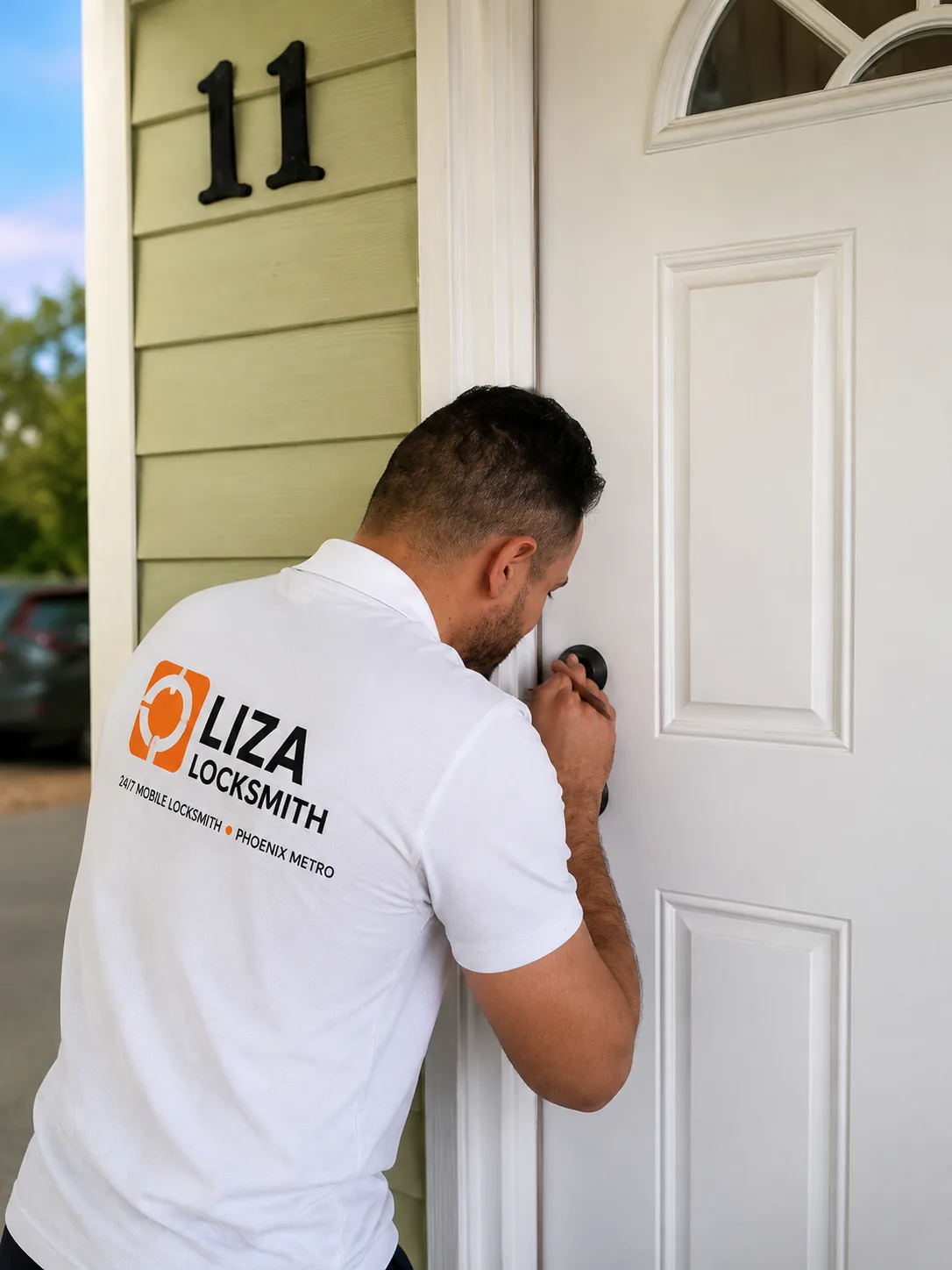 Locksmith unlocking a residential front door during a Phoenix house lockout call